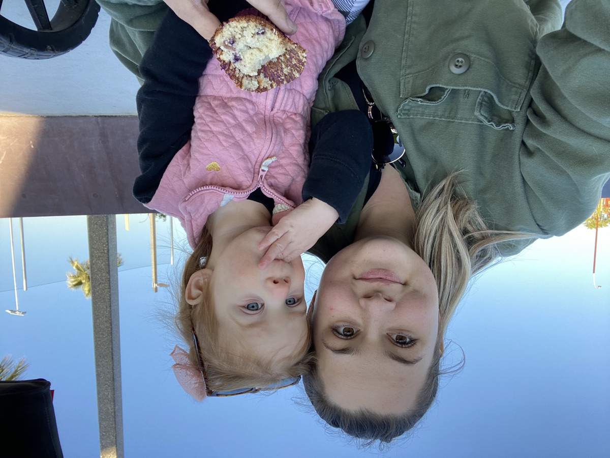 Soraya with child enjoying a treat outdoors
