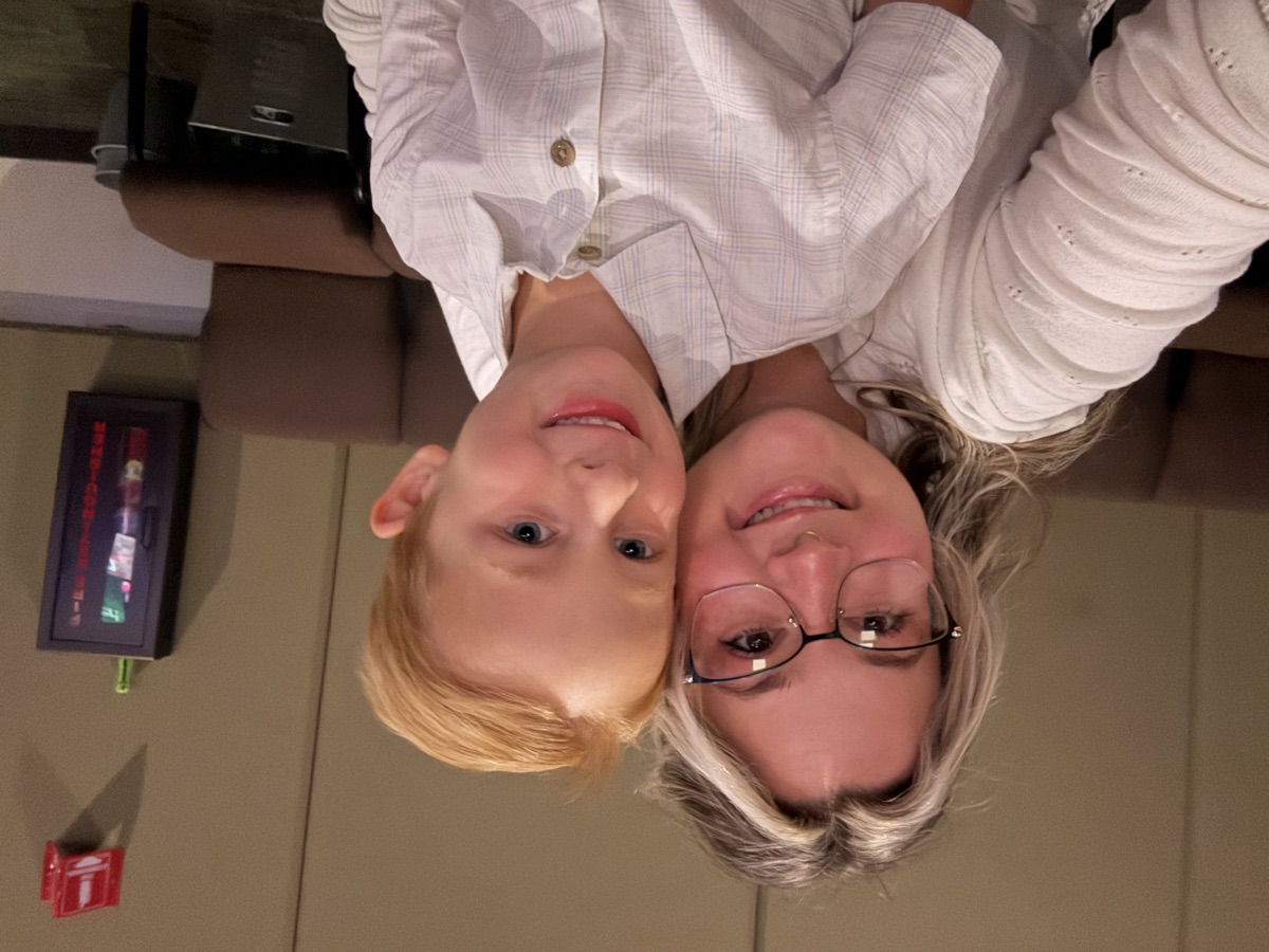 Soraya and child posing together at home